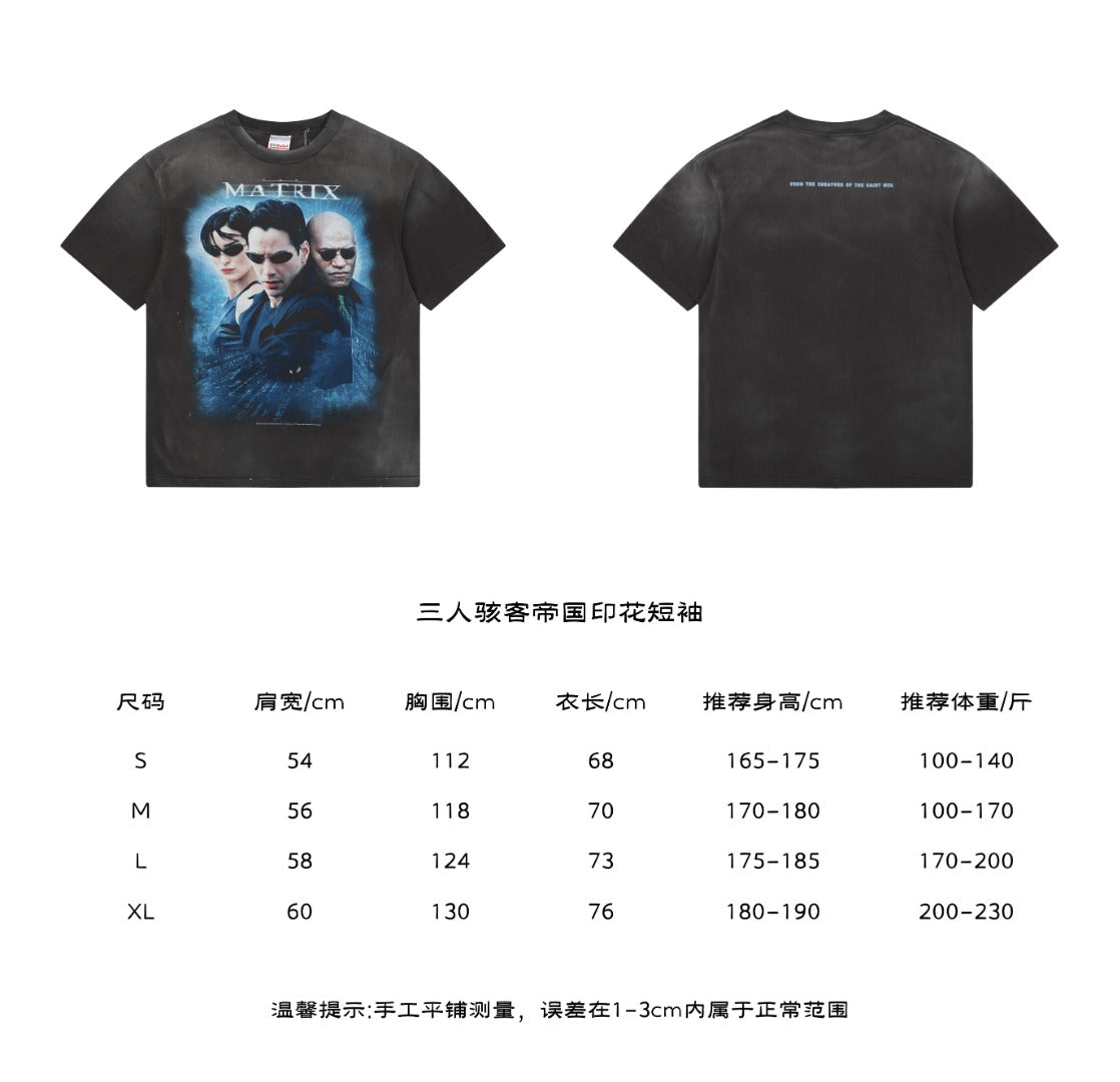 Saint Michael x The Matrix Trio Portrait Graphic Tee in Washed Black – front Matrix print and back quote text with size chart